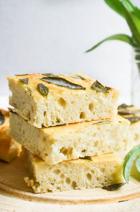 Sage focaccia takes is topped with fresh sage leaves that bake up to a deliciously crisp topping on this chewy bread. Slice it up as an appetizer or serve make it part of a healthy Mediterranean meal. #focaccia #Italian #bread #flatbread #sage Sage Focaccia, Sage Bread, Crisp Topping, The View From Great Island, Chewy Bread, Focaccia Recipe, Sage Leaf, Fresh Sage, Yeast Breads