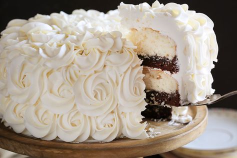 Stunning rosettes cover this flavorful cake... white cake layers complemented with rich fudgey brownie deliciousness! White Layer Cake, White Cake Recipe, I Am Baker, Fudgy Brownie, Cake White, Cake Layers, Buttercream Recipe, White Cake Mixes, New Cake