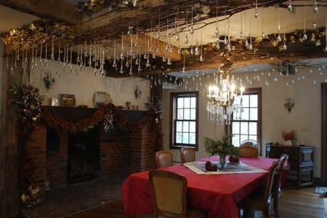 Gorgeous glass icicles hanging off  natural wood beams. So lovely. Decorating Wood Beams For Christmas, Ceiling Beam Christmas Decor, Natural Wood Beams, Christmas Centre Pieces, Magnolia Garland, Deborah Silver, Garden Designer, Hanging Garland, Exposed Wood