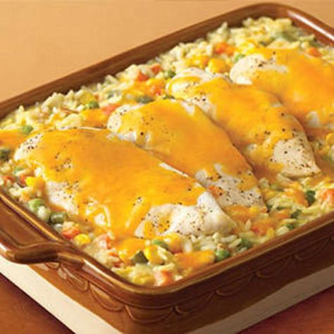 Cheesy Chicken & Rice Casserole | Rachael Ray Every Day Cheesy Chicken And Rice Casserole, Cheesy Chicken Rice Casserole, Cheesy Chicken And Rice, Cheesy Chicken Rice, Chicken And Rice Casserole, Chicken Rice Casserole, Rice Casserole Recipes, Hearty Casseroles, Yummy Chicken