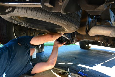 Man repairing a car or truck. Man fixing underneath the truck. Mechanic working. , #sponsored, #truck, #fixing, #Mechanic, #Man, #repairing #ad Mechanic Working On Car, Mechanic Man, Truck Mechanic, Truck Photo, Car Poses, About Cars, Doctor Picture, Car Inspiration, New Photo Download