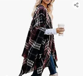 The Bestshe Women's Boho Poncho is a stylish and cozy wrap featuring a knitted plaid design, open front, and fringe tassel accents. Perfect as a lightweight layer, this versatile cape cardigan adds a chic, bohemian touch to any outfit. (Amazon)