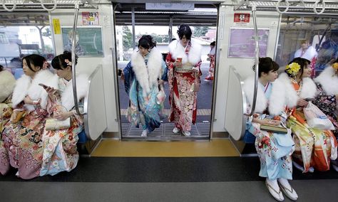 Japanese women in kimonos board a train after attending a ceremony on Coming of Age Day – a national holiday to celebrate those who have reached the age of 20, considered to be the beginning of adulthood Photograph: Kiyoshi Ota/EPA Coming Of Age Day, National Holiday, Japanese Outfits, World Cultures, Coming Of Age, Japanese Women, A Train, Tokyo Japan, The Age