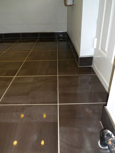 Tiled skirting board with chrome trim Tiled Skirting Boards, Tile Skirting Ideas, Tiled Skirting, Tiles Skirting, Tile Mosaic Floor, Tile Skirting, Oak Floor Living Room, Tile Baseboard, Hardwood Floor Care