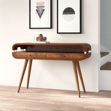 A great option for creating an eye-catching décor display, or storing post and keys, console tables round out your living room or hallway with a welcoming touch. Sure to create an eye-catching look, this design is crafted from solid ash wood and features an oval silhouette with spindle legs and sleek cutouts for a retro-inspired twist. Two drawers and a shelf lend this table a bit of extra storage for essential items. Interior Design Kitchen Contemporary, Console Table Design, Console Table Hallway, Hallway Table, Hall Table, Wood Console Table, Wood Console, Essential Items, Decor Display