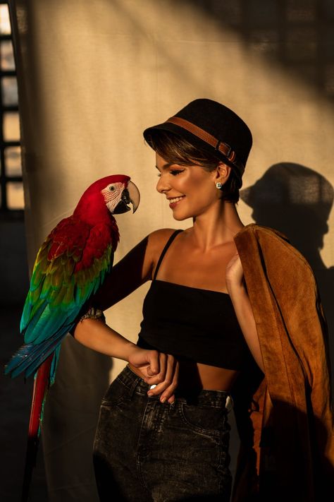 Scarlet Macaw on Woman's Arm Bird Photoshoot, Parrot Training, Animal Photoshoot, Spaghetti Strap Crop Top, Human Food, Wear Crop Top, Pet Bird, Photo Retouching, How To Pose