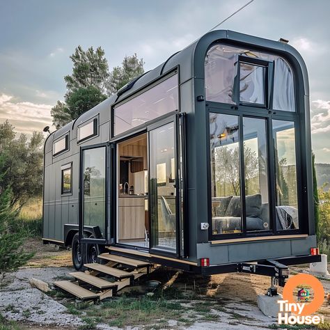 "Check out this stunning tiny house on wheels!  With its Mediterranean design style and beautiful Charcoal Gray and White color palette, this home is a true gem. What's your favorite design element? Would you incorporate any into your own home? #TinyHouse #MediterraneanDesign #TinyLiving" Tiny Homes On Wheels, Tiny Mobile House, White Color Palette, Glass House Design, Mobile House, Tiny House Inspiration, Mediterranean Design, Van Living, Cottage Plan