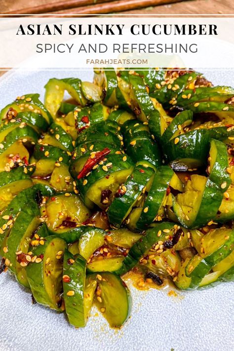 Spicy Asian Slinky Cucumber Salad served on a white plate. Crunchy Asian Cucumber Salad, Cucumber Noodles Recipes, Curly Cucumber Salad, Crunchy Cucumber Salad, Cucumbers With A Bang, Chinese Cucumber Salad Recipe, Leftover Cucumbers, Viral Cucumber Salad, Spiral Cucumber Salad