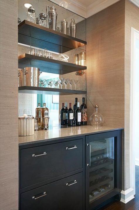 Chic butler's pantry boasts a nook filled with grey cabinets fitted with a glass-front beverage fridge placed under grey floating shelves lining a mirrored backsplash. Bar Nook, Bar Mini, Modern Home Bar, Bar In Casa, Home Bar Design, Built In Bar, Decor Ikea, Home Bar Designs, Mini Bars