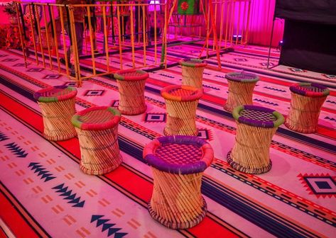 Punjabi style seating plan - Cane ottoman with customised cushions over the designer carpet Punjabi Theme Party Decor, Punjabi Theme Decoration, Cane Ottoman, Mayra Decor, Indian Destination Wedding, Designer Carpet, Sitting Arrangement, Punjabi Style, Seating Plan