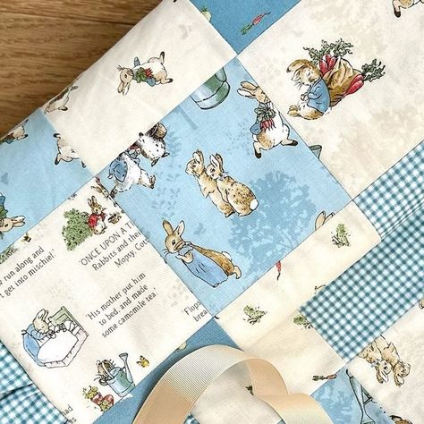 Sara Brown on Instagram: "I just couldn’t wait any longer to share this. I 1) wish I knew how to sew when my babies were born and 2) had this fabric back then so I could make this sweet baby quilt for one of them. @rileyblakedesigns The Tales of Peter Rabbit is super adorable. I made a simple patchwork quilt and added a ruffle using the collection’s blue gingham instead of binding! It was a little extra effort but very worth it. #rileyblakedesigns #rileyblakefabric #thetalesofpeterrabbit #thetalesofpeterrabbitfabric #babyquilt #rufflequilt #babyboyquilt" Peter Rabbit Quilt, Simple Patchwork Quilt, Sara Brown, Ruffle Quilt, Riley Blake Fabric, Baby Boy Quilts, Patchwork Quilt, Blue Gingham, Peter Rabbit