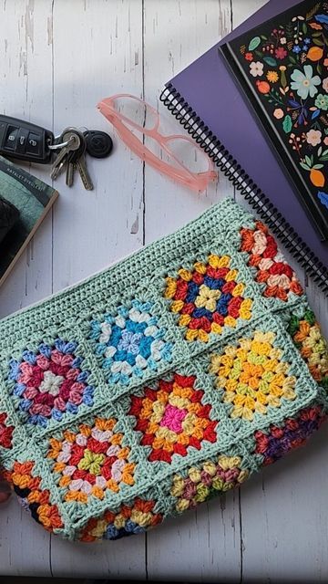 Handmade Crochet Bags by Alev on Instagram: "Colorful Crochet Granny Square Clutch which can be use as an All day pouch or also as a cosmetic purse, make up bag or toiletrie clutch in Boho style 🤗🤗⛱️🌴 📍33×23cm 📍100% handmade 📍Linned ,with a small pocket inside and closure zipper 📍I used Washable cotton yarns You can wash your bag in sensitive section. 🧡🩷❤💛💚💙🩵💜🤍🩶 #crochetbagpatterns  #crochetclutchbag #crochetclutch #crochetbaghandmade  #grannysquarebag #bohobags #crochetmarketbag Granny Square Zipper Bag, Granny Square Zipper Pouch Pattern, Granny Square Clutch Bag, Crochet Granny Square Clutch, Granny Square Clutch Pattern, Granny Square Makeup Bag, Pochette Granny Crochet, Granny Square Zipper Pouch, Crochet Makeup Pouch