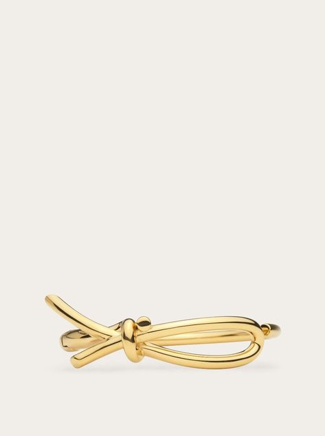 Shop Bracelet with asymmetric bow (L) at the official Ferragamo online store. Enjoy free Shipping and Returns. Bow Women, Bow Bracelet, Gold Bracelet For Women, Belt Accessories, Easy Wear, The Star, The Line, Salvatore Ferragamo, Womens Jewelry Bracelets