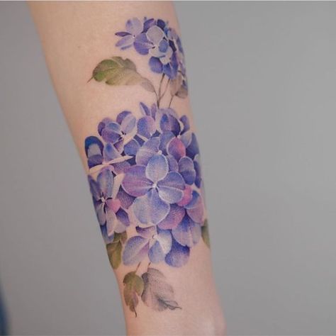 Hydrangea flowers are beautiful. They are an amazing shade of blue, and they have a delicate, almost-transparent quality to them. Their petals look li... Purple Flower Tattoos, No Tattoo, Hydrangea Tattoo, Blue Flower Tattoos, Purple Tattoos, Garden Tattoos, Pin Up Tattoos, Bee Tattoo, Calf Tattoo