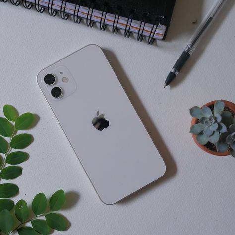 iPhone 12 white on table with plants Iphone 12 Mini White Aesthetic, Iphone 12 Aesthetic White, White Iphone 11 Aesthetic, Iphone 11 Aesthetic Phone, White Iphone Aesthetic, Iphone 12 Pro White, Iphone 12 Aesthetic, Iphone 12 White, Iphone Dp