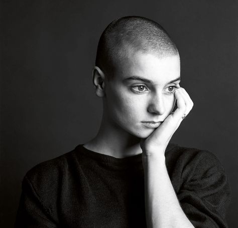 Sinead O’Connor, 1990 O’Connor made People magazine’s list for the year’s 25 Most Intriguing People, and Preston was assigned to get shots of her for that issue. “I don’t know how she is now, but she was very serious,” he recalled. “And I have a slightly snarky sense of humor.” Preston was tasked with getting some light-hearted pictures, and he considered it a breakthrough when he finally got her to smile in one of them. “She was a really tough one to crack,” he said. “I mean I did everything I Shave Her Head, Monochrome Wall, Music Photographer, Bald Hair, Bald Women, Shaved Head, Buzz Cut, Shaved Hair, 2024 Vision