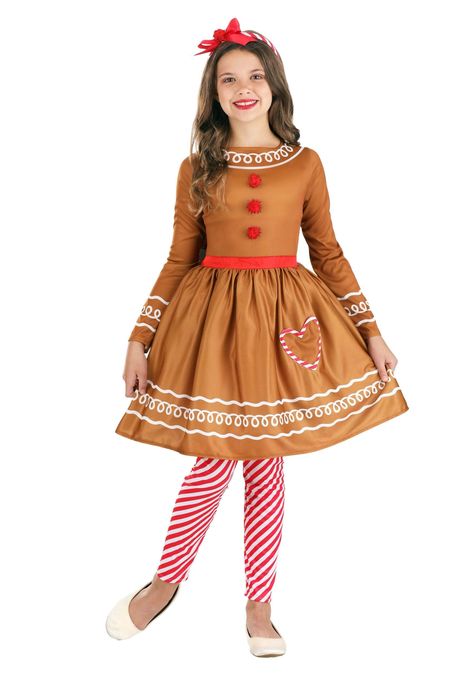 PRICES MAY VARY. Size: Medium 100% polyester jersey knit fabric Dress has back zipper, elastic back waistband Sewn in satin ribbon waist sash, built in petticoat Heart shaped patch pocket on left front of skirt You'll look like sugar and spice and everything nice in this exclusive Gingerbread Costume Dress for Girls! The knee-length brown dress zips up the back and is accented with printed white "frosting" details. The bodice is decorated with three red pom-poms and the attached red sash ties at Gingerbread Costume, Girl Gingerbread, Gingerbread Person, Knit Fabric Dress, Red Tights, White Frosting, Crocheting Ideas, Gingerbread Girl, Costume Store