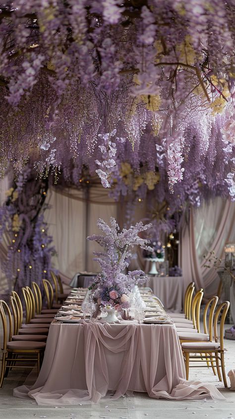 Elegant lavender dreamscape: Dive into a floral fantasy with cascading wisterias for a wedding reception that feels like a fairy tale. Garden Themed Wedding Ceremony, Fairy Garden Ideas Wedding, Fairy Wedding Venue Ideas, Lavender Center Piece Wedding, Floral Theme Wedding Decoration, Wedding Ideas Purple And Gold, Lavender Reception Decorations, Lilac Spring Wedding, Wisteria Themed Wedding