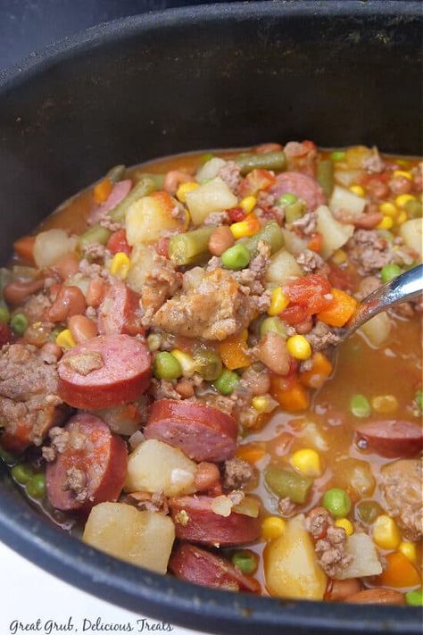 Cowboy Stew is a hearty and filling dinner recipe loaded with tender potatoes, three types of meat, seasonings, and vegetables. Italian Stew, Cowboy Stew, Mild Italian Sausage, Filling Dinner, Hot Italian Sausage, Slow Cooker Beef Stew, Beef Stew Meat, Hearty Stews, Delicious Treats