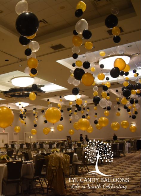 Glamourizing this ballroom for a big formal event! From the many bubble strands hung from the ceiling to the large 30" gold balloons used as centerpieces around the room.  #eyecandyballoons #nhballoons #balloons #balloondecor Formal Events Decorations, School Banquet Ideas, Ceiling Balloons Decorations, Balloon Hanging From Ceiling, Hang Balloons From Ceiling, Party Hall Decor Ideas, Hanging Balloons From Ceiling, Ceiling Balloon Decorations, Nye 2024