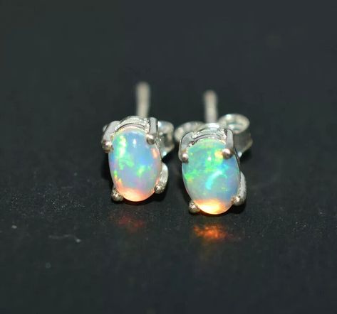 Elevate your style with these 100% original Fire Opal Gemstone stud earrings! Handcrafted with love and featuring a multicolor natural Opal stone, these Sterling Silver beauties are perfect for any special occasion. ✨💎 #OpalEarrings #HandcraftedJewelry #BohemianStyle #HealingCrystals #SterlingSilver #FashionStatement  #Engagement #Graduation #Wedding #Christening #Birthday #Christmas #ConfirmationCommunion #SameasPicture #MothersDay #Anniversary #ValentinesDay #eBay #eBayStore #eBaySeller Ethiopian Opal Jewelry, Opal Earring, Blue Opal Earrings, White Opal Earrings, Fire Opal Earrings, Ring Ceremony, Opal Stud Earrings, Traditional Jewellery, Earring Silver