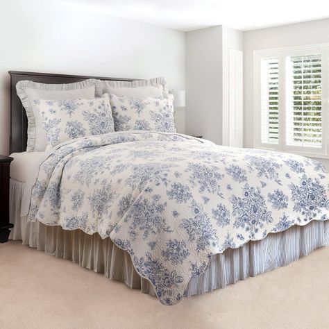 Add a touch of shabby chic style to your bedroom with the Sutton Blue Vintage Rose cotton quilt set. With a blue on white vintage rose print, this stylish bedding creates a timeless look in your bedroom suite. Reverse to a blue and white ticking stripe pattern for additional styling options. Crafted of cotton, this quilt set is machine washable for easy care. Complete your bedroom suite with the coordinating Classic Blue Stripe euro shams and bed skirt. Features: All over vintage rose print Hand Sutton Blue, Timeless Bedding, Cotton Quilt Set, Grey Linen Bedding, Ruffle Bedding, Blue Home Decor, Stylish Beds, Bedding Stores, Blue Quilts