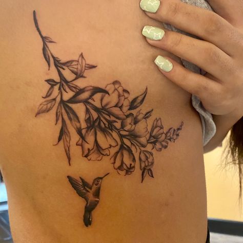 tat by @nick_arte on insta Hummingbird Side Tattoo, Hummingbird Tattoo Side Ribs, Hummingbird Rib Tattoo, Flower And Hummingbird Tattoo Thigh, Flower Bouquet With Hummingbird Tattoo, Wildflower Tattoo With Hummingbird, Side Tat, Rib Tattoos For Women, Hummingbird Flowers