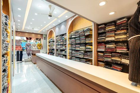 Zeal - Fashion Galore Store | Designer's Port | Thane – Interiorlover Projects Clothing Store Counter Design, Store Counter Design, Clothes Shop Design, Shop Counter Design, Store Shelves Design, Jaali Design, Cloth Shop, Decorative Room Dividers, Shelves Design