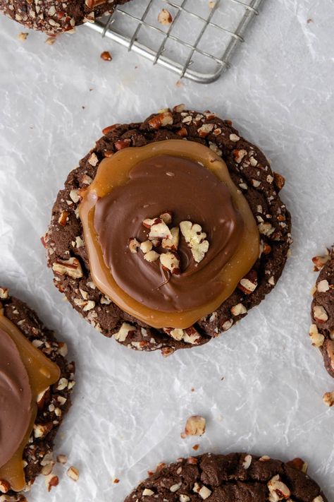 These Crumbl turtle cookies are made with a thick chocolate cookie rolled in pecans topped with caramel and milk chocolate. So good!