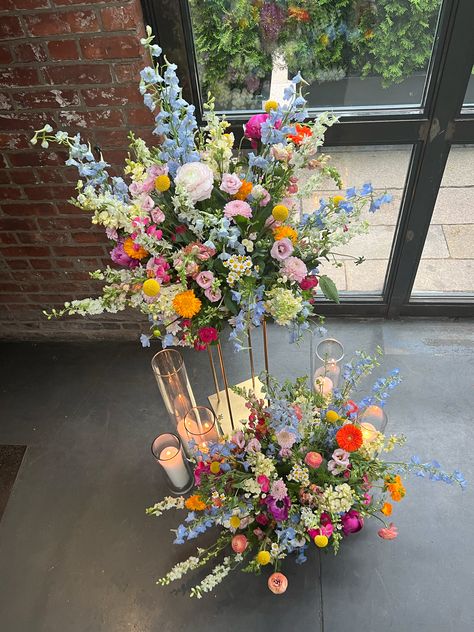 Tall Wildflower Arrangements, Wedding Flowers Arrangements Table, Interesting Floral Arrangements, Wild Flower Bouquet Wedding Wildflowers Wildflower Centerpieces, Multicolor Flower Wedding, Floral Wedding Photo Backdrop, Statement Wedding Florals, Wildflower Altar Arrangement, Wedding Tent Flower Ceiling