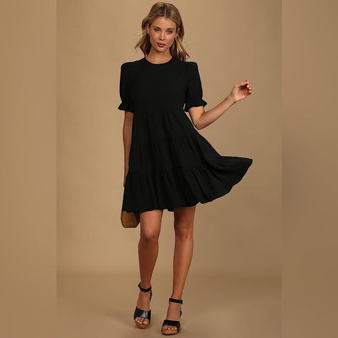 Lulus Favorite Day Black Puff Sleeve Tiered Mini Dress Brand New + With Tags Color: Black Just Purchased But Did Not Fit And Missed The Return Window Size: Medium Lulus Exclusive! Make Any Day The Best Day Ever With The Lulus Favorite Day Black Puff Sleeve Tiered Mini Dress! Lightweight Crinkly Woven Fabric Shapes This Dress That Has A Crew Neckline, Puffy Short Sleeves With Elastic Ruffle Cuffs, And A Relaxed Bodice. The Swingy Skirt Is Accented With Rows Of Tiers Before Ending At A Mini Hem. K Black Mini Dresses Party, Black Short Sleeve Sundress, Black Casual Dress Outfit, Classic Black Dress Outfit, Short Black Dress Formal, Black Dress Business Casual, Black Dress Graduation, Accessories Black Dress, Black Summer Dresses