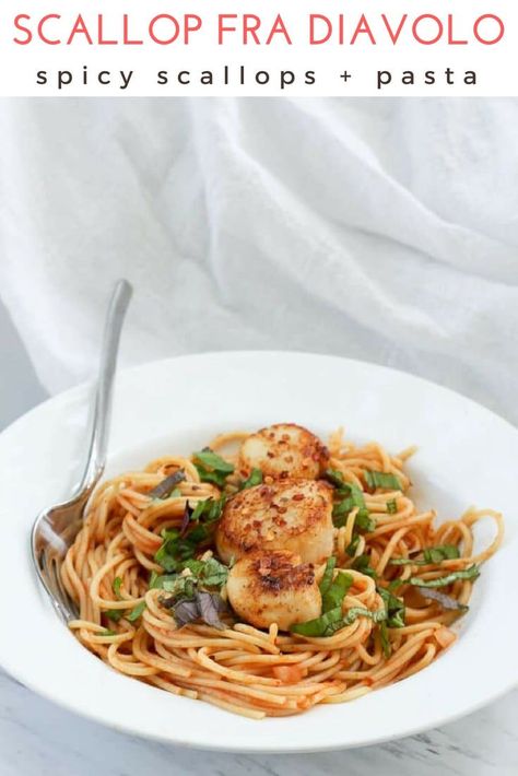 This easy recipe for scallop fra diavolo features sea scallops and pasta for an easy date night meal.  This pasta is tossed in a spicy red sauce, and the scallops are seasoned with red chili pepper, for an easy seafood dinner. #seafood #seascallops #datenight #pasta via @champagneta0249 Scallops And Pasta, Spicy Seafood Pasta, Scallop Recipes Pasta, Spicy Red Sauce, Easy Seafood Dinner, Scallop Pasta, Dinner Seafood, Fra Diavolo, Seared Fish