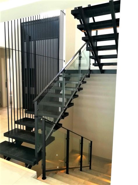 Mild steel double stringer staircase with black granite treads and glass balustrades. Steel Balustrade, Rod Iron, Glass Stairs, Steel Stairs, Granite Tops, Glass Balustrade, Outdoor Stairs, Black Granite, Black Glass