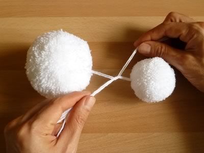 Homemade Craft Ideas | Tighten the knot so that the two pom poms come together firmly. Secure ... Christmas Snowman Decorations, Snowman Craft Ideas, Christmas Pom Pom Crafts, Diy Schneemann, Diy Osterschmuck, Christmas Pom Pom, Snowman Craft, Snowman Christmas Decorations, How To Make A Pom Pom