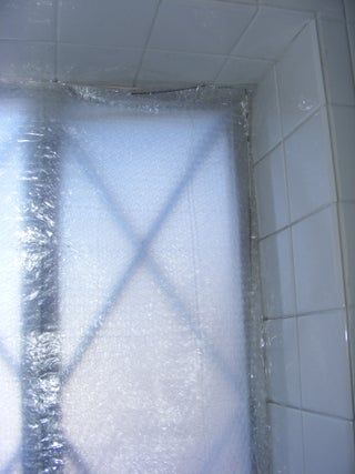 Bubble Wrap Storm Window (Insert) : 5 Steps (with Pictures) - Instructables Bubble Wrap Windows, Sliding Glass Windows, Window Inserts, Window Shelves, Dollar Tree Store, Wire Hangers, Shower Tub, Glass Window, Dollar Tree