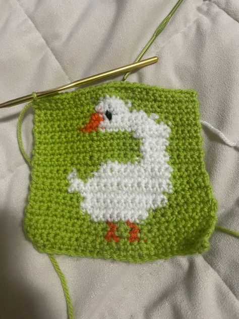 I crocheted single stitches. Next time I would take out a row in their neck. #crochet #duck Goose Granny Square, Duck Crochet Sweater, Duck Sweater Knitting Pattern, Duck Granny Square Pattern, Crochet Duck Sweater, Pixel Crochet Sweater, Duck Granny Square, Duck Pixel Art, Blanket Squares