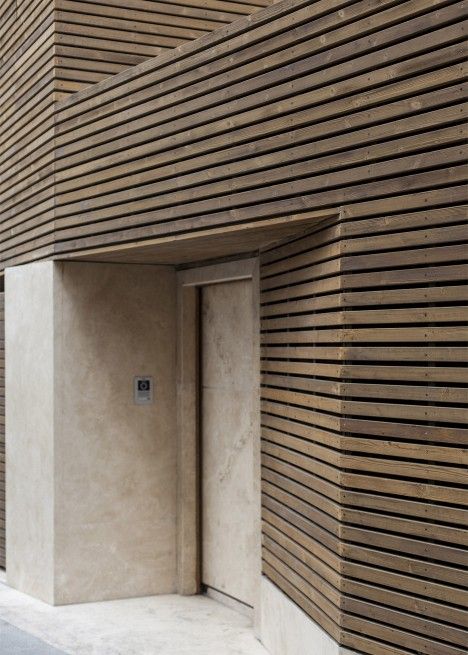 Bagh-Janat residential architecture with timber and travertine cladding in Isfahan Iran by Bracket Design Studio Wooden Cladding, Wood Facade, Wooden Facade, Timber Slats, House Cladding, Cladding Materials, Wood Cladding, Casa Container, Timber Cladding