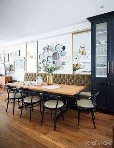 An olive green upholstered banquette gives this eclectic kitchen a gastro-pub vibe. | Photographer: Angus Fergusson | Designer: Erin Feasby and Cindy Bleeks  An olive green uphol Dining Room Banquette, Banquette Dining, Banquette Seating In Kitchen, Upholstered Banquette, Dining Banquette, Kitchen Banquette, Dining Room Remodel, Eclectic Kitchen, Kitchen Light