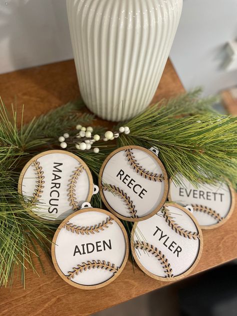 "Personalized Baseball Ornament with Engraved Name Custom Christmas Ornament, Sport Ornament, Laser Engraved, Made of Wood [ Purchase Includes ]  ♡ 1x Personalized Baseball Ornament [ Digital Preview ] By default we do not* send a digital preview for the ornament orders. This is so we can proceed to the creating phase and have them shipped out as soon as possible to receive before Christmas. If you want a digital preview you must request a digital preview in the notes to seller field when placin Personalized Wood Ornaments, Custom Ornaments, Laser Ornaments, Laser Engraver Projects, Diy Baseball Ornaments, Sports Ornaments Diy, Wooden Engraved Ornaments, Laser Engraving Ideas Projects, Christmas Ornaments Laser Engraved