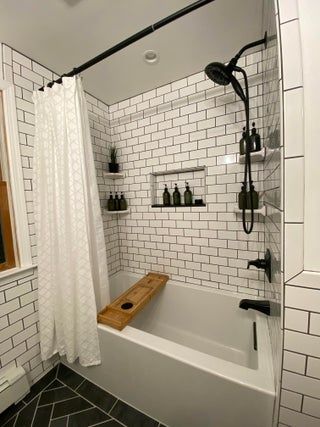 After 5 years, we finally updated our ugly master bathroom! : AmateurRoomPorn Tiled Tub Shower Combo Farmhouse, Big Bathtub Shower Combo, Bathrooms With Tubs And Shower Combo, Small Bathroom Black Floor, Bath Tub And Shower Combo Ideas, Tub Shower With Tile, Tiled Shower With Tub, Tiled Shower Ideas With Tub, Black And White Bathroom Ideas Modern