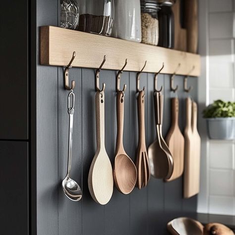 25 Clever Kitchen Cabinet Storage Ideas to Maximize Space Hang Measuring Cups And Spoons, Kitchen Wall Organization Ideas, Kitchen Wall Organization, Measuring Spoons Organization, Wall Organization Ideas, Lazy Susan Corner Cabinet, Kitchen Cabinet Storage Ideas, Kitchen Wall Organizer, Cabinet Storage Ideas