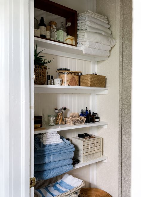 Leney Breeden Folkling House Tour Photos | Apartment Therapy No Bathroom Storage Solutions, Bathroom Built In Organization, Vintage Linen Closet, Small Family Bathroom Storage, Vintage Bathroom Organization, Small Bathroom Linen Closet Ideas, Small Powder Room Storage, Vintage Bathroom Shelves, Books In Bathroom