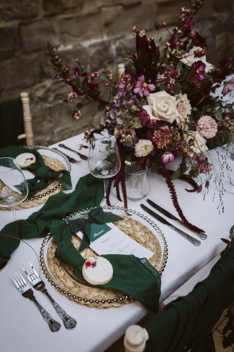 Dark red, pink and white wedding bouquets on white tablecloth with wicker place mat, dark green napkin and wedding place name with biscuit wedding favours | wedding table decoration | wedding autumnal and winter theme | wedding favours | Hannah Brooke Photography Red Tablecloth Wedding, Green Burgundy Wedding, Winter Theme Wedding, Green And Burgundy Wedding, Biscuit Wedding Favours, Pink And White Wedding, Autumnal Wedding, Pink And White Weddings, Favours Wedding