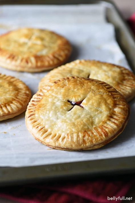 picture of a cranberry hand pie on a baking tray Christmas Hand Pies, Cranberry Orange Pound Cake, Pie Pastry Recipe, Potatoe Salad, Pie Pastry, Leftover Cranberry Sauce, Seasonal Desserts, Hand Pie, Pastry Recipe