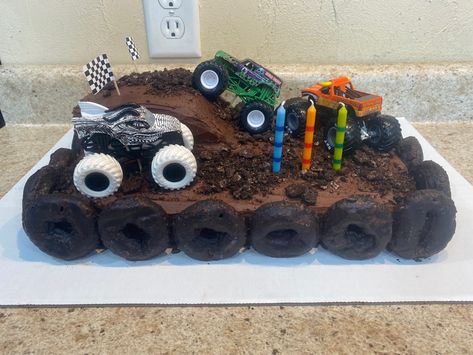 Monster Truck Bday Cake, Monster Truck And Dinosaur Cake, Young Wild And Three Monster Truck, Monster Jam Cupcakes Ideas, Monster Jam Cupcake Cake, Monster Truck Dirt Cake, Dinosaur Monster Truck Cake, Monster Truck 3rd Birthday Cake, Monster Truck Birthday Snacks