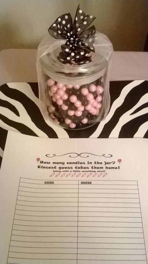 Simple "guess amount of candies in the jar" game. Black and pink sixlets in a bow adorned jar from the craft store.  Created and printed an answer sheet and viola! Guess Candy In Jar Game, Guess The Amount Of Candy In The Jar, Guessing Jar Ideas, Candy Jar Guessing Game, Guessing Jar, Work Appreciation, Intentional Teaching, Golf Fundraiser, Jar Games