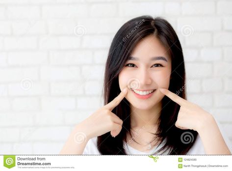 Portrait+of+beautiful+young+asian+woman+happiness+standing+finger+touch+cheek+on+gray+cement+texture+grunge+wall+brick+background%2C+businesswoman+is+a+smiling+on+concrete%2C+business+people+concept. Finger On Cheek Pose, Touching Cheek Pose, Cement Texture, Wall Brick, Brick Background, Finger Touch, Happy Images, Business People, Strike A Pose