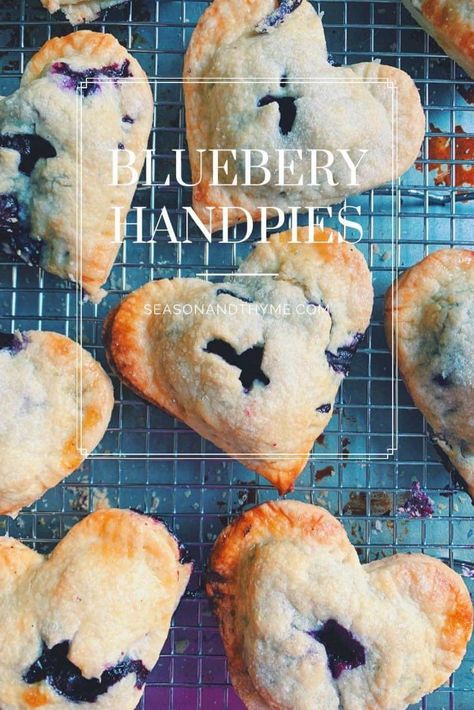 Heart-Shaped Blueberry Hand Pies - Season & Thyme  Heart Shaped hand pies make the perfect Valentine's Day Dessert. Perfectly portioned and adorable, these are a fun activity to make with your loved ones. Valentines Hand Pies, Blueberry Hand Pies Easy, Ree Drummond Blueberry Hand Pies, Blueberry Hand Pies, Blue Heart-shaped Ring For Valentine's Day, Banana Pie, Hand Pie Recipes, Hand Pie, Romantic Meals