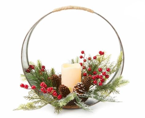 Bring a stunning seasonal look to your home during the holidays using this centerpiece. A galvanized ring frame is accented with an artificial arrangement of pine needles, pinecones and berries as an LED candle illuminates warmly in the center. It's a beautiful addition to a mantel, table or shelf display. Winter Wedding Table Centerpieces, Holiday Party Centerpieces, Winter Table Centerpieces, Christmas Party Centerpieces, Christmas Wedding Centerpieces, Xmas Centerpieces, Winter Floral Arrangements, Christmas Dining Table Decor, Christmas Centers