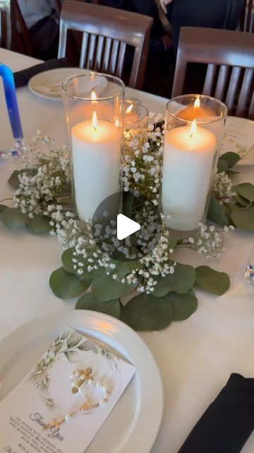 Orlando Party Rentals & Decor on Instagram: "Are you looking for a Baptism Centerpieces that transform your tables into a elegant and charming decoration? ✨ Our latest creation features the delicate elegance of eucalyptus, the charm of baby’s breath, and the warm glow of candles. Watch the magic unfold!  . . . . . #partydecor #orlandopartydecorations #orlandopartyplanner #orlandoflorida #orlandopartyrentals #partyrentals #partyrentalorlando #balloondecor #orlandoballoons #orlandopartydecor #kidspartydecor #kissimmee #wintergardenfl #orlandolocal #lakemary #lakenona #saintcloud #windermerefl #balloongarland #genderreveal  #baptismcandle #baptism" Candle Baptism Centerpieces, Baby Girl Baptism Centerpieces, Baptism Centerpieces Ideas, Baptism Centerpieces For Boys, Baptism Decorations Centerpieces, Flameless Candle Centerpiece, Baptism Table Decor, Baby Baptism Party, Communion Table Decorations